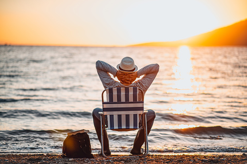 man-relaxing-on-beach